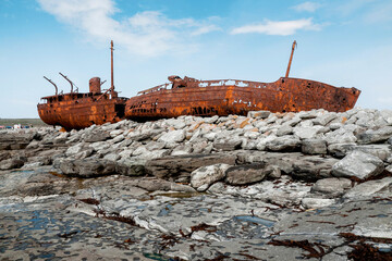 Plassey shipwreck on shore of Inisheer island. Aran islands, county Galway, Ireland. Rough stone...