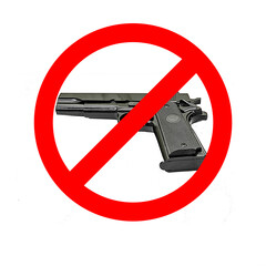 Handgun Danger. Isolated. Gun is forbidden. Copy Space. Photo of a gun with a forbidden red icon on a white background. Stock Image