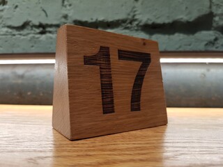 Numeral 17 on the wooden table
