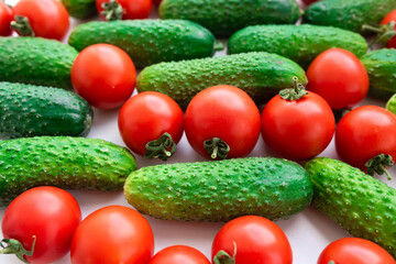 Fresh vegetables tomatoes and cucumbers on the table