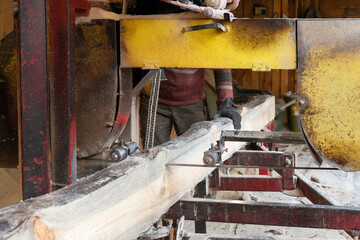 The process of processing and sawing wood at an old sawmill. timber industry