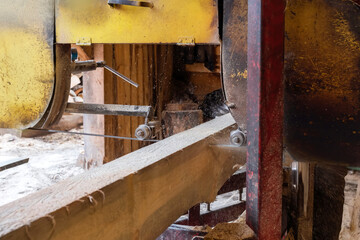 The process of processing wood at an old sawmill. Timber industry