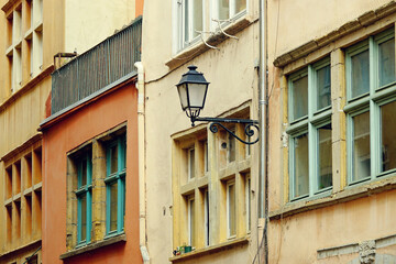 Fototapeta na wymiar Old colorful buildings and lantern in Vieux Lyon, historical district of Lyon, Avergne-Rhône-Alpes, France