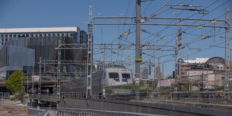 A long-distance train X2000 type train leaving the central station a sunny day in Stockholm