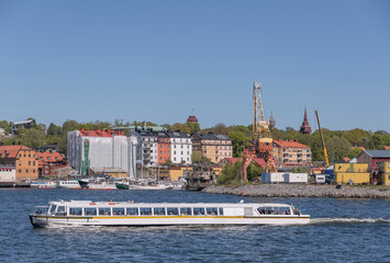 Sightseeing boat on a trip in the harbor a sunny day in Stockholm
