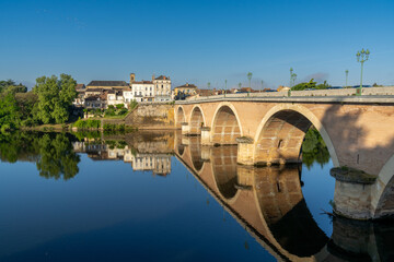 Fototapeta na wymiar view of the Dordogne River and old stone bridge leading to Bergerac