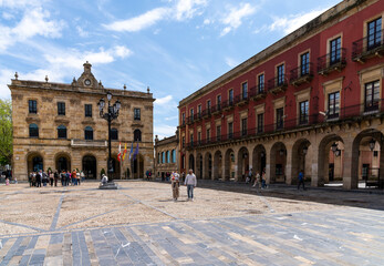 Fototapeta na wymiar the Plaza Mayor Square with people enjoying a sunny day out in the historic city center of Gijon