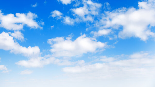 Sunny day background, blue sky with white cumulus clouds, natural summer or spring background with perfect hot day weather.