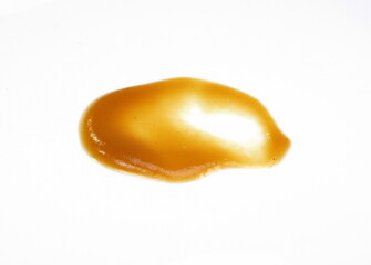 Baby puree spilled on white background. Baby fruit puddle isolated.