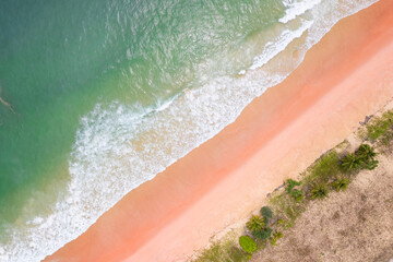 Aerial view sandy beach and waves Beautiful tropical sea in the morning summer season image by Aerial view drone shot, high angle view Top down sea waves in summer season