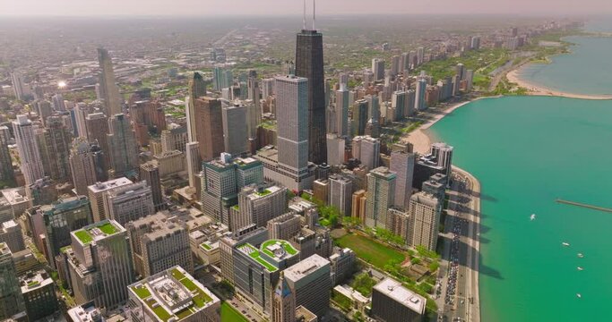 Breathtaking scenery of Chicago city on sunny day. Endless city panorama beside beautiful Lake Michigan.