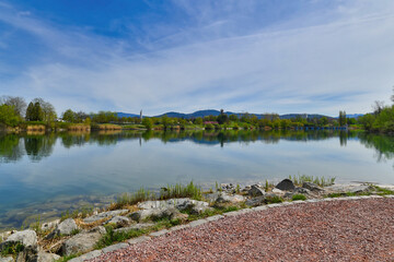 Obraz premium Freiburg, Germany - Lake in public park called 'Seepark' on sunny spring day