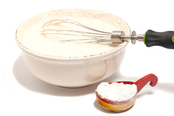 Mixing baking ingredients isolated on white background