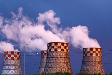 Factory pipes thermal power plants with thick white smoke from heat energy nuclear plant polluting...