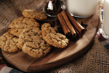 Glass of milk and cookies on table