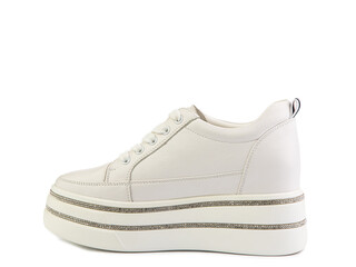 White classic leather trainers. Casual women's style. White lacing and white rubber soles. Isolated...