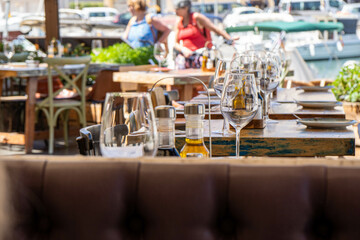 restaurant tables in a restaurant with people in the background