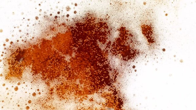 Super Slow Motion Detail Shot of Rippling Beer Bubbles and Foam