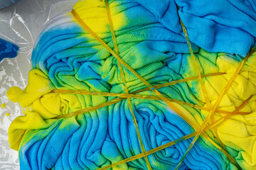 wrinkled fabric yellow and blue texture close up