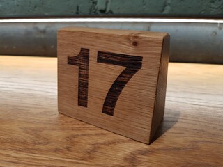 Numeral 17 on the wooden table