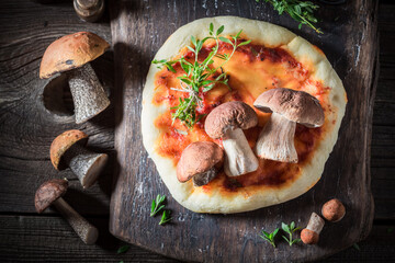 Tasty pizza made of wild mushrooms and herbs.