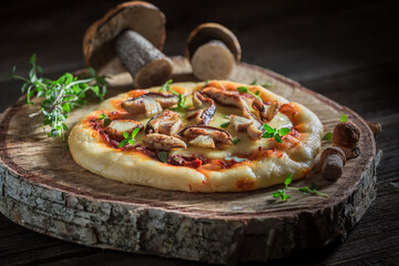 Delicious pizza made of wild mushrooms and herbs.