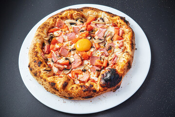 pizza on the black background, top view