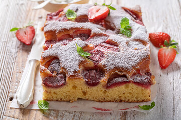 Homemade and sweet strawberry cake with fresh fruits and sugar.