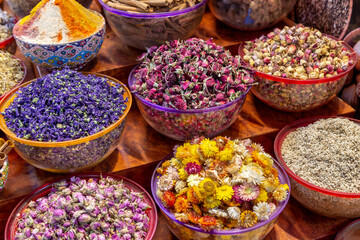 Variety of Arabic spices and dried flowers in the traditional market in Dubai