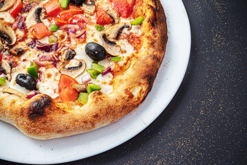 pizza on the black background, top view