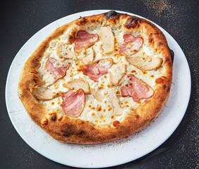 pizza on the black background, top view