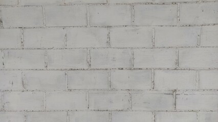 Obraz premium Old dirty white wall of old warehouse in urban area