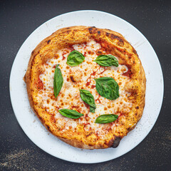 pizza on the black background, top view