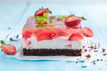 Delicious strawberry jelly cake with fluffy cream layer.