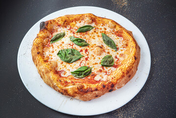 pizza on the black background, top view