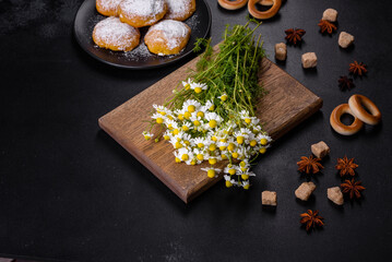 Garden camomile flowers bouquet on a yellow concrete table