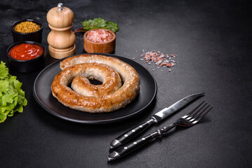Baked homemade sausage with spices and herbs, close up