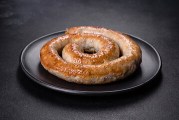 Baked homemade sausage with spices and herbs, close up