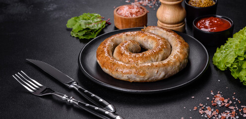 Baked homemade sausage with spices and herbs, close up