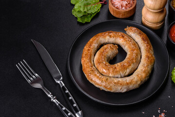 Baked homemade sausage with spices and herbs, close up