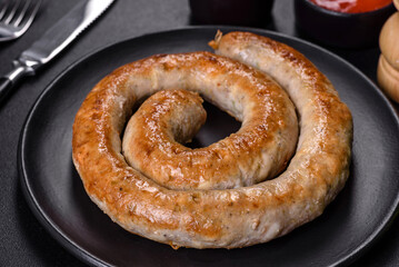 Baked homemade sausage with spices and herbs, close up
