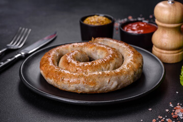 Baked homemade sausage with spices and herbs, close up