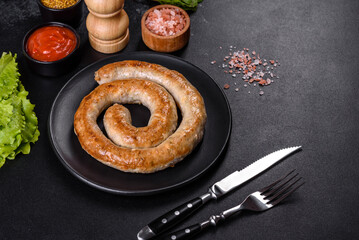 Baked homemade sausage with spices and herbs, close up