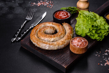 Baked homemade sausage with spices and herbs, close up