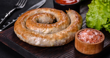 Baked homemade sausage with spices and herbs, close up