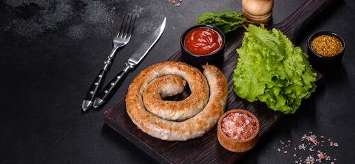 Baked homemade sausage with spices and herbs, close up
