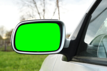Side mirror of a car with a green background for adding a video. Side view mirror.