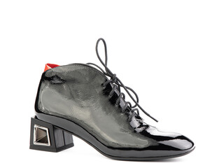 Women's autumn ankle black leather boots with black zip and average heels, isolated white background. Right side view. Fashion shoes.