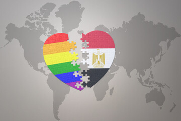 puzzle heart with the rainbow gay flag and egypt on a world map background. Concept.