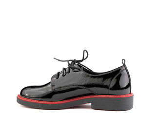 Women's oxford black leather shoes with red stripe isolated white background. Left side view....